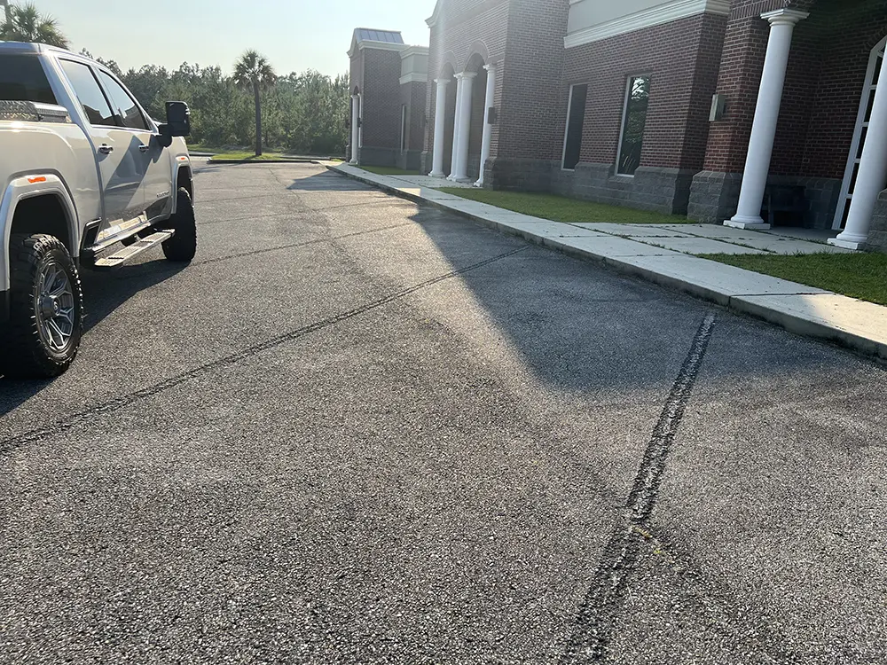 before parking lot Asphalt resurfacing and repair with clear coat and striping by Image Striping Company