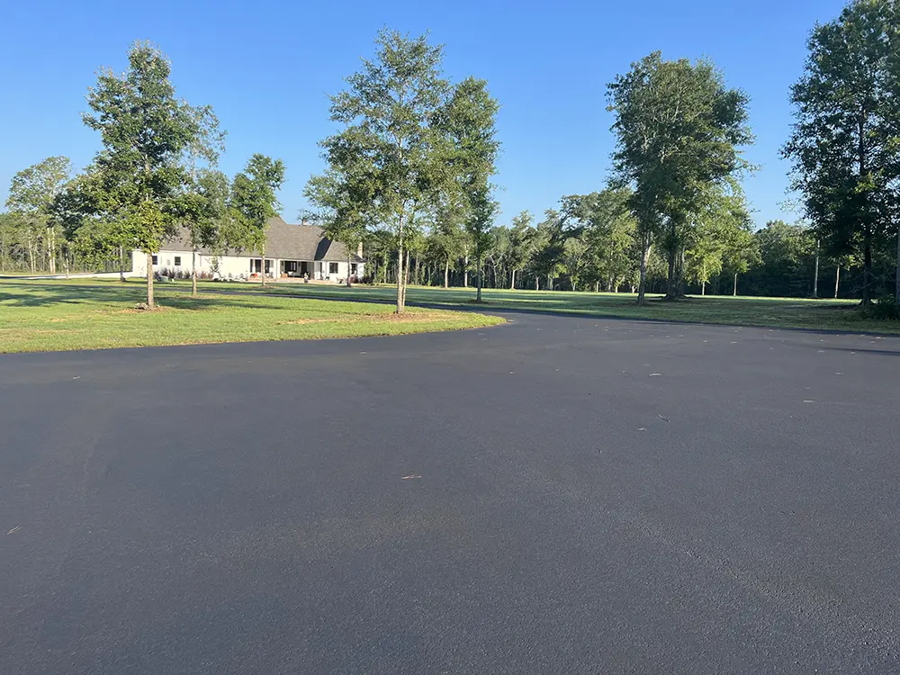 residential application of asphalt seal coating by Image Striping Company